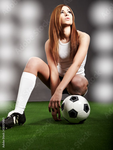 Sexy soccer player, woman on playing field