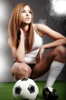 Sexy soccer player, woman on playing field
