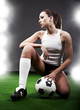 Sexy soccer player, woman on playing field