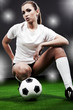 Sexy soccer player, woman on playing field