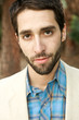 Attractive Young Man looking sternly at camera