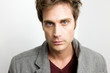 Attractive Young Man looking sternly at camera