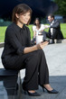 Beautiful Young Chinese Asian Woman Texting and Drinking Coffee