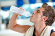 Photo: Gym man drinking water Gym man drinking water