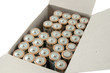 box of small batteries isolated on white background