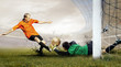 Shoot of football player and jump of goalkeeper on the field of Shoot of football player and jump of goalkeeper on the field of