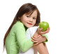 a girl with a green apple