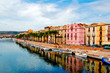 Street with palm trees along the coast in bosa, sardegna Street with palm trees along the coast in bosa, sardegna