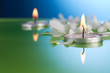 Burning Floating Candles and Flowers