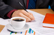 Young handsome businessman working with documents Young handsome businessman working with documents