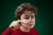 Boy using magnifying glass