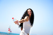Beautiful young woman holding a bottle of water.