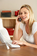 Mother At Home Using Computer