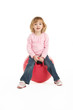 Photo: Young Girl Having Fun On Inflatable Hopper Young Girl Having Fun On Inflatable Hopper
