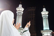 Young woman, muslim pilgrim in white traditional clothes Young woman, muslim pilgrim in white traditional clothes