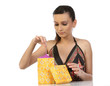 young woman taking the gift from the gift box