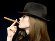 girl in black with a cigarette in a hand girl in black with a cigarette in a hand