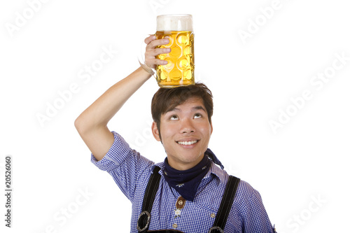 Foto: Happy man with Oktoberfest beer stein on head - Maßkrug Happy man with Oktoberfest beer stein on head - Maßkrug