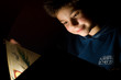 Young boy reading book