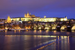 Snowy Prague gothic Castle with Charles Bridge in the Night