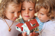 children three together keeping in hands model of house children three together keeping in hands model of house
