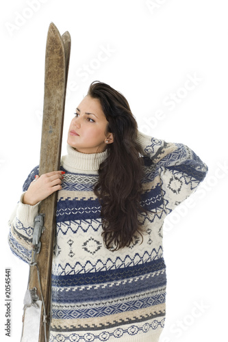 Photo: portrait of young woman holding old wooden ski portrait of young woman holding old wooden ski