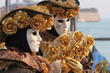 Venice carnival mask posing along St.Mark promenade