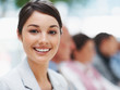 Happy business woman in a meeting with colleagues