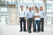 Confident business people standing together in group