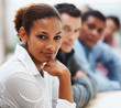 Black business woman in conference with associates Black business woman in conference with associates