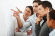 Foto: Group of business people looking at a chart on the wall Group of business people looking at a chart on the wall