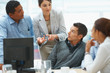 Young business woman explaining a project to colleagues