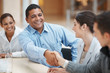 Business executives handshaking after striking a deal