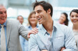 A young business executive enjoying success with team