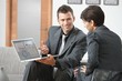 Businessman presenting on laptop