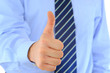 Photo: Thumb's up by a businessman. Approval, Good Work! Thumb's up by a businessman. Approval, Good Work!