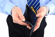 Businessman well-dressed with empry wallet isolated over white Businessman well-dressed with empry wallet isolated over white