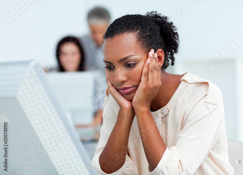 Photo: Bored businesswoman at her desk Bored businesswoman at her desk