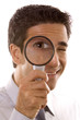 Man holding a magnifier