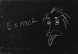 Ooops. The genius Albert Einstein show tongue. Sketch on blackbo