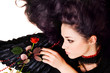 Beautiful black angel with a scarlet rose Beautiful black angel with a scarlet rose