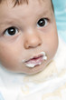 Baby boy with food around his mouth