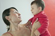 Young woman holding baby boy