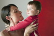 Young woman holding baby boy