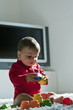 Baby boy playing with toys