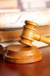 Judges gavel with very old books