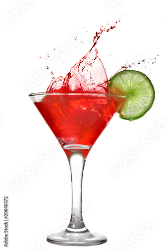 Photo: Red cocktail with splash and lime isolated on white Red cocktail with splash and lime isolated on white