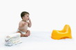 Baby boy with diapers and potty