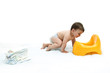 Baby boy with diapers and potty