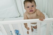 Baby boy in crib upset